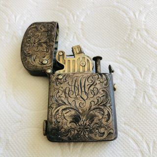 NASSAU Dec.  26,  1905 push button lighter.  Sterling Silver chased and monogramed. 3