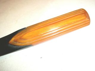 A Scarce Art Deco Carvacraft Amber Phenolic Catalin Letter Opener