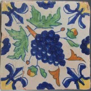 Dutch Delft Polychrome Tile,  Grapes And Fleur - De - Lis,  Early 17th.  Century.