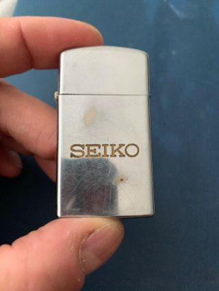 Vintage 1976 Slim Chrome Seiko In Brass Logo Watches Advertising Zippo Lighter