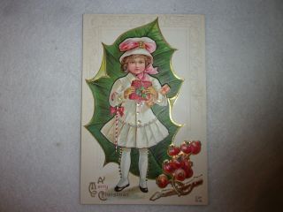 Vintage Christmas Postcard Girl With Present Holly Leaf And Berries Circa 1910