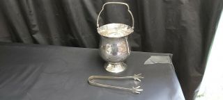 A Vintage Silver Plated Ice Bucket With Tongs.