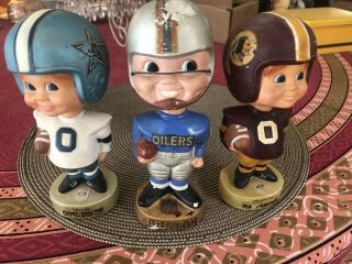 Three Vintage Nfl Bobbleheads Oilers,  Cowboys,  Redskins