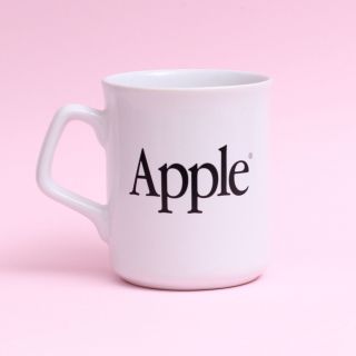 White Apple Computer Mug With Black Apple Logos On Both Sides