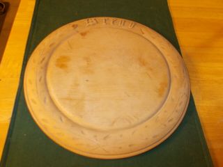 Late 1800s Early 1900s Wooden Round Bread Board For Cutting With Bread Carved On