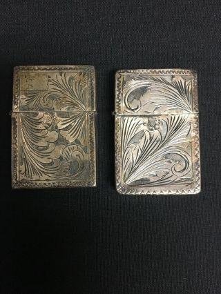 A Vintage Italian 800 Silver Hand Chased Zippo Lighter Cases