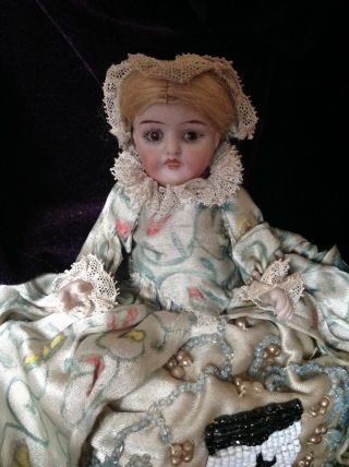 Pretty Antique All Bisque Doll With Closed Mouth,  Glass Eyes And Old Costume