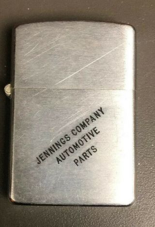 Vintage Zippo Cigarette Lighter With Lettering On It.