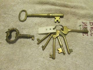 Old Vintage/antique Brass Keys - One Has A Face On It.