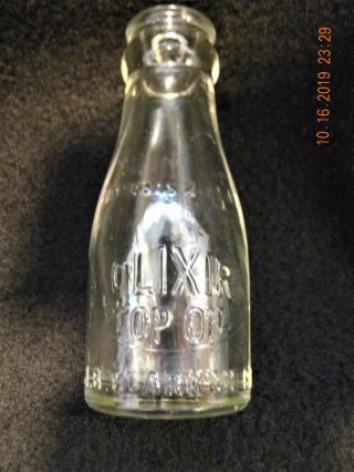 Vintage 2 Ounce Olixir Top Oil Glass Bottle J.  B.  Clark Oil Co.