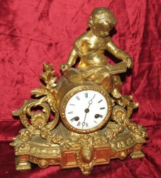 A Delightful French Gilt Metal Mantle Clock With Child Figure