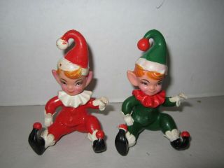 2 Vintage Hard Rubber Elf / Pixie Figurine - Red & Green.  Made Hong Kong.  3 - 1/2 "