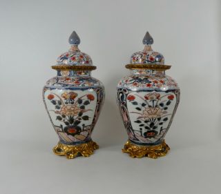 Pair Japanese Imari Porcelain Vases & Covers.  C.  1690.  Genroku Period.  Ormolu.