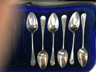 A Set Of Six Vintage Solid Silver Teaspoons With Embossed Shaped Handles