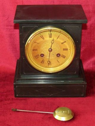 A Delightful Small French Black Marble Mantle Clock With Brass Dial