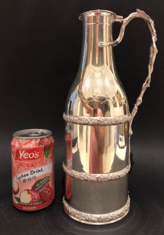 A Fine And Rare French Sterling Silver Wine Bottle Holder By Emile Hugo