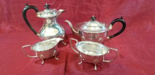 An Antique 4 Piece Silver Plated Tea Set By Walker & Hall Of Sheffield.