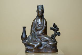 Antique Chinese Bronze Figure Of Guanyin.  Flanked By Bird In A Bush And Water Jug