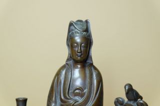 Antique Chinese Bronze Figure Of GuanYin.  Flanked by bird in a bush and water jug 2