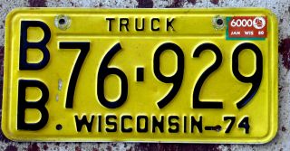 1974 Black On Yellow Wisconsin Truck License Plate With A 1980 6000 Lbs.  Sticker