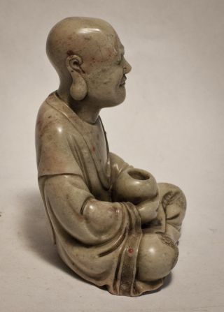 Antique carved steatite figure of a seated Luohan with incised robes 2