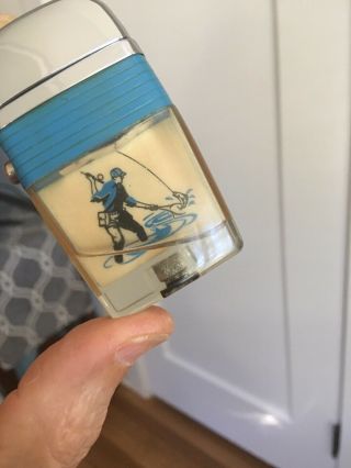 1950/60’s Vintage Scripto Vu Lighter With Fisherman -.