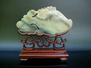 A Large Antique Chinese Celadon Jade Carving Of Fish With Stand