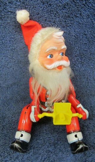 Vintage Mechanical Christmas Santa Tin Toy Motorcycle Rider Swivel Rubber Face