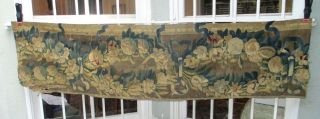 A Large 18th Century Tapestry Fragment With Garlands Of Flowers