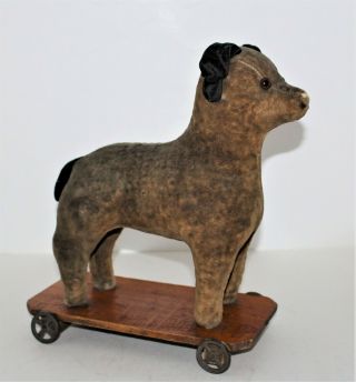 Antique Plush Fur Dog On Wheels Pull Toy