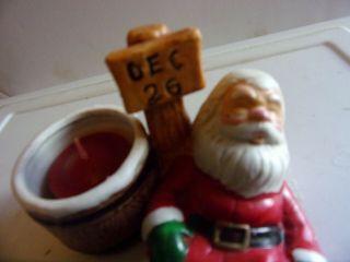 SANTA DEC 26 WITH CANDLE SLEEPING SIZE 4.  25 