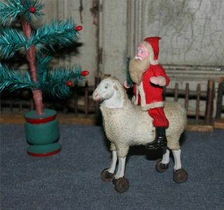 Antique 5 " Putz Stick Leg Wooly Sheep & Clay Face Santa Pull Toy