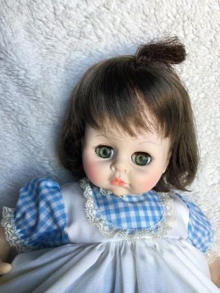 Madame Alexander 14” Pussy Cat Doll With Brunette Hair,  Green Eyes,  Blue Dress