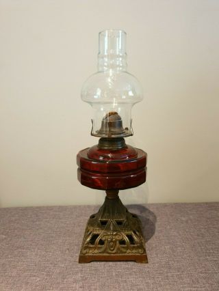 Antique Victorian Ruby Glass And Cast Iron Hurricane Table Oil Lamp (with Flue)