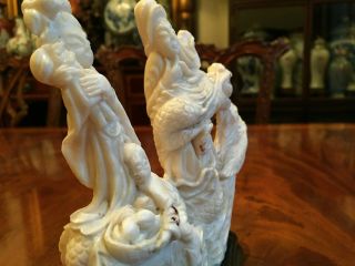 A Chinese Antique Carved White Coral Figural Statue With Wooden Stand.