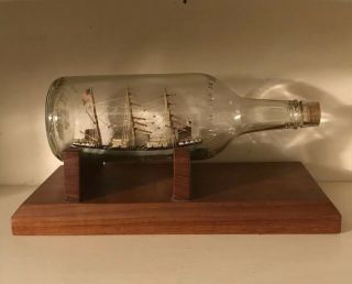 Antique Model Ship In A Bottle With Wooden Display Stand
