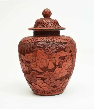 A Large And Rare Chinese Qing Dynasty Cinnabar Covered Vase With Wooden Stand.