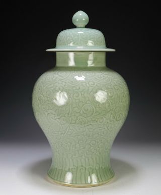 Antique Chinese Celadon Glazed Covered Jar With Carved Dragons