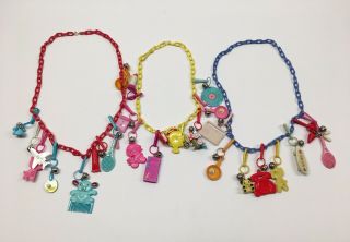 Vintage 1980’s Red,  Yellow & Blue Plastic Necklace With Bell Clip Charms (3)