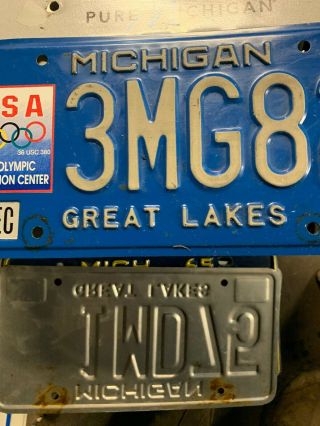 Michigan Great Lakes US Olympic Education Center License Plate Tab 97 3MG82. 3