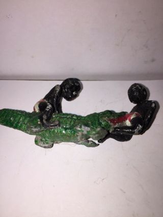 Antique Lead Figure Of Two Black Boys Fighting A Large Alligator.