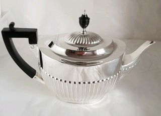 A Victorian Sterling Silver Tea Pot.  London 1900.  By William Hutton & Sons Ltd