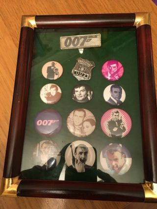 13 Rare Vintage James Bond 007 Badges Or Pins Mounted In A Display Case