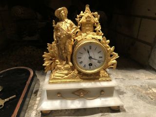 Antique French P.  H.  Mourey Gold Gilt Figural Mantle Clock On A Alabaster Base