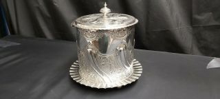 An Antique Silver Plated Biscuit Barrel With Embossed Patterns.  J.  Dixon.  Sheffield