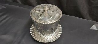 An Antique Silver Plated Biscuit Barrel With Embossed Patterns.  j.  dixon.  sheffield 2