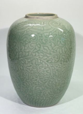 Chinese Celadon Green Vase Surface Decorated With Scrolling Foliage.