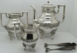 Chinese Export Silver 4 Piece Tea Service.  Fierce Dragon Feet,  Floral C.  1900