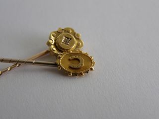 2 antique 9ct / 15ct gold stick pins horseshoe & diamond 2.  26 gram scarp or wear 3