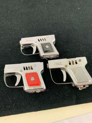 3 Vintage Miniature Gun Shaped Pocket Lighters - One Is Mioj